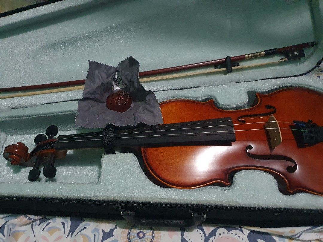 Violin with Case and Bow (Category: Musical Instruments) located in Manila. Submitted by magaoaymar91391 (Listing ID 1463059067, Image 2). Description: Selling a complete student violin setup originally purchased from The String Department for ₱10,000. Overall in great structural condition, but needs a new set of strings as the G (lowest) string recently snapped. Price has been adjusted down to account for the replacement set. ​Price: ₱8,500 (Neg