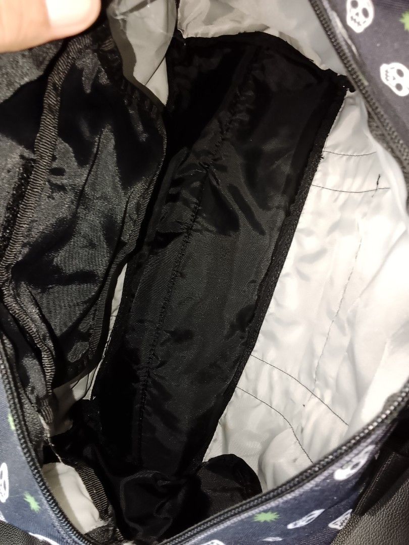 Vintage Volcom skull- print duffle bag (Category: Briefcases) located in Manila. Submitted by newage.vintage (Listing ID 1462898364, Image 3). Description: - retro Volcom logo - dual zipper - multiple pocket on duffle bag - all over print skull print - heavy duty black nylon straps - functionality: travel bag, gym bag, or skate companion - vintage Volcom duffle bag.