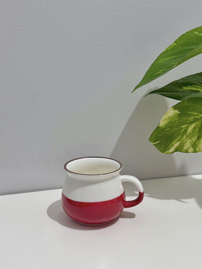 White and Red Ceramic Mug with Brown Rim (Category: Coffee & Tea Tableware) located in Makati City. Submitted by ariannelaz54133 (Listing ID 1462927584, Image 1). Description: - Cute ceramic mug - White with a bold red band around the bottom - Brown trim around the rim - White handle - Ideal for morning coffee or tea - Dishwasher safe (confirmation recommended) - Please check photos for exact appearance.