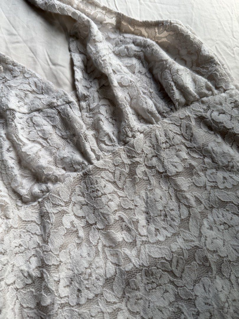 White Lace Halter Top with Satin Lining (Category: Sleeveless) located in Makati City. Submitted by angelinanicole (Listing ID 1462994526, Image 3). Description: - White lace halter top - Soft satin lining - Ties at the neck - Features a pretty floral lace pattern.