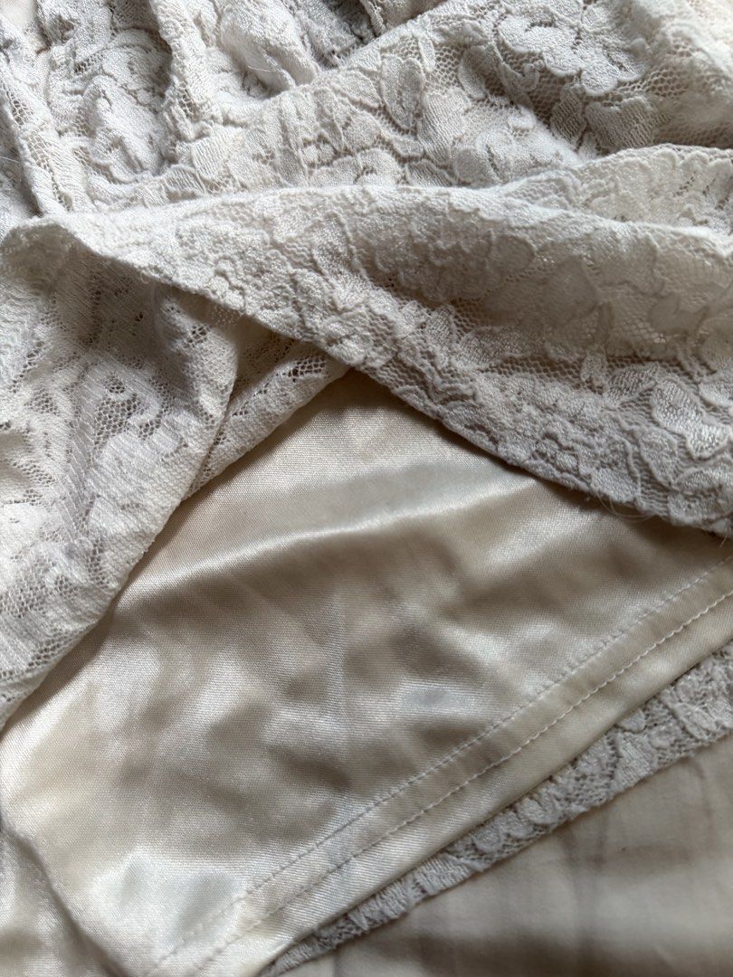 White Lace Halter Top with Satin Lining (Category: Sleeveless) located in Makati City. Submitted by angelinanicole (Listing ID 1462994526, Image 2). Description: - White lace halter top - Soft satin lining - Ties at the neck - Features a pretty floral lace pattern.