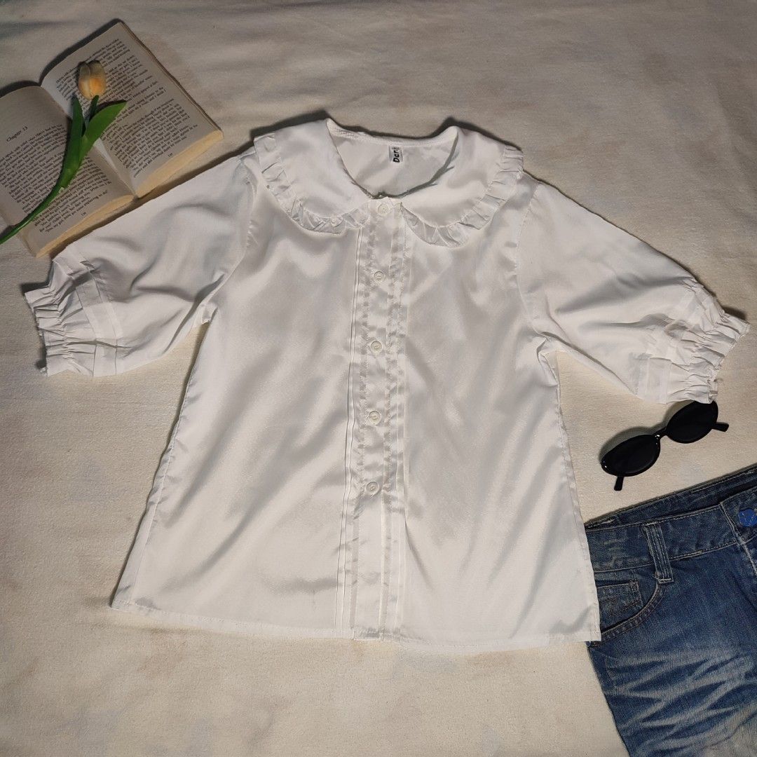 White Peter Pan Collar Blouse with Ruffle Details (Category: Blouses) located in Antipolo. Submitted by _lovedbychie (Listing ID 1462896857, Image 1). Description: 🌸 Size: S-M 🌸 Bust: 34"• Length: 21" 🌸 MOP: Gcash / Maribank 🌸 MOD: J&T / LBC / Lalamove Message me for more info!.