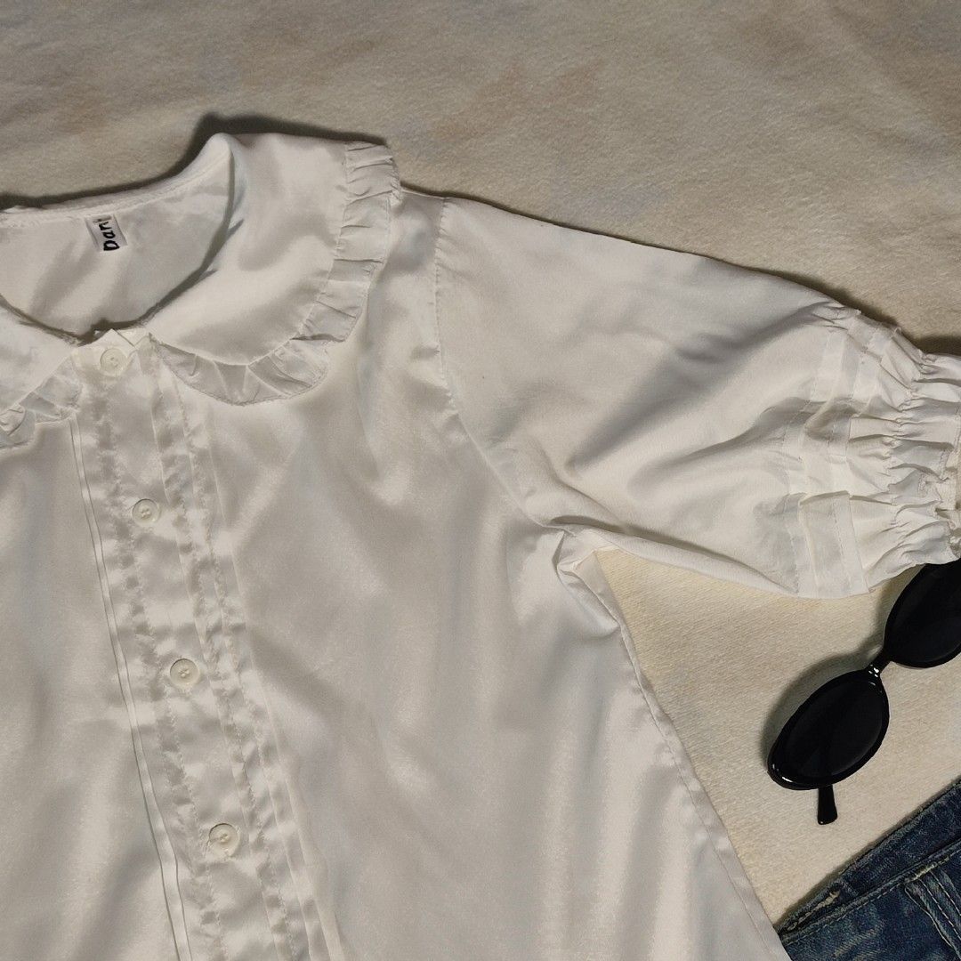 White Peter Pan Collar Blouse with Ruffle Details (Category: Blouses) located in Antipolo. Submitted by _lovedbychie (Listing ID 1462896857, Image 3). Description: 🌸 Size: S-M 🌸 Bust: 34"• Length: 21" 🌸 MOP: Gcash / Maribank 🌸 MOD: J&T / LBC / Lalamove Message me for more info!.