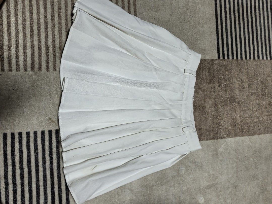 White Pleated Mini Skirt (Category: Skirts) located in Quezon City. Submitted by desespinas (Listing ID 1463004293, Image 2). Description: PERFECT FOR PICKLE BALL OUTFIT - White pleated mini skirt - High-waisted style with belt loops - Estimated size: Medium - Versatile for casual or dressed-up outfits - Easy to pair with various tops.