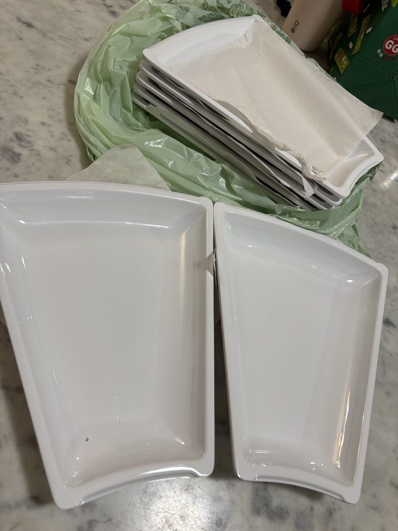 White Rectangular Serving Trays Set (Category: Dinnerware & Cutlery) located in Singapore. Submitted by mitokomon (Listing ID 1463025355, Image 2). Description: - White rectangular serving trays size 20x10x25 cm - Stackable design for easy storage - Ideal for parties, snacks, or desserts - Features slightly curved brand new , we have too many 3.5 $ for all 7 trays.
