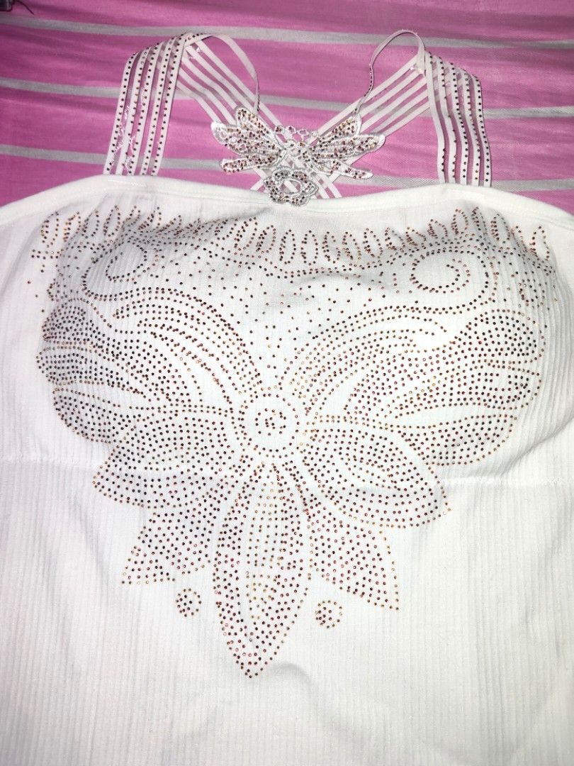 White Rhinestone Butterfly Halter Tank Top (Category: Sleeveless) located in Manila. Submitted by pink_orchidd (Listing ID 1463090394, Image 2). Description: - White halter top - Sparkly rhinestone pattern on front - Criss-cross back straps with butterfly embellishment.