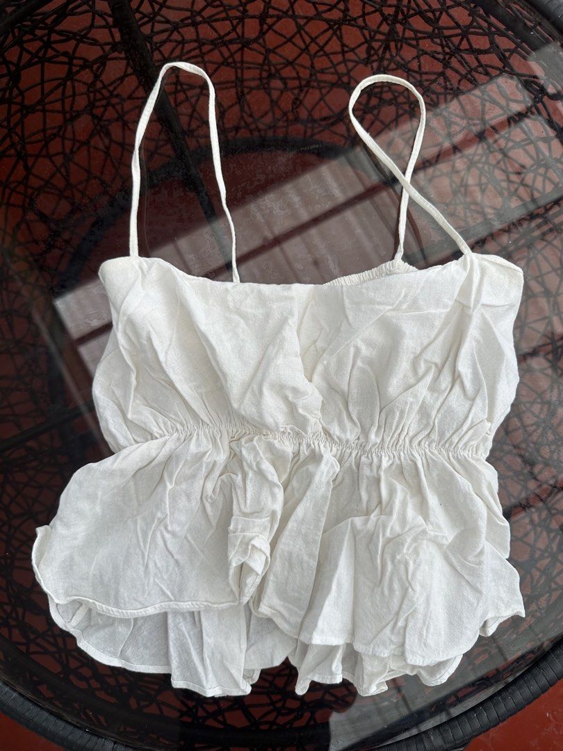 White Ruffle Spaghetti Strap Crop Top (Category: Sleeveless) located in Manila. Submitted by dandrey.collectives (Listing ID 1463049317, Image 1). Description: - Def a fave! - Light and airy fabric .