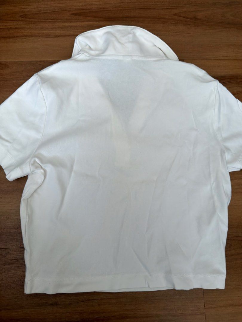 White Short Sleeve Collared Polo Shirt (Category: Tshirts & Polo Shirts ) located in Quezon City. Submitted by bschu (Listing ID 1462938670, Image 2). Description: - Classic white polo shirt - Short sleeves - Collared neckline - Versatile for casual wear or sports - Easy to match with any outfit - Offers a clean and neat look.