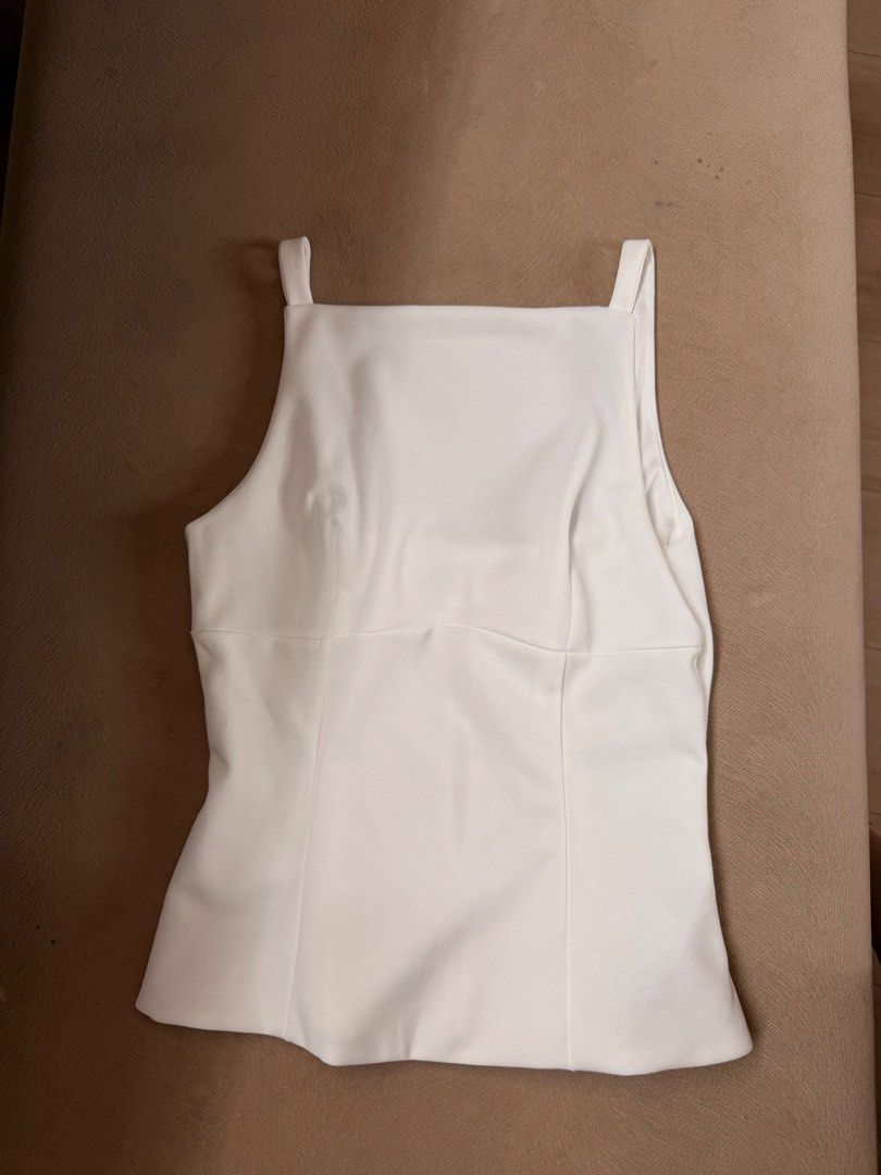 White Square Neck Top with Black Bow Detail (Category: Blouses) located in San Juan City. Submitted by elkaytea27 (Listing ID 1462947323, Image 2). Description: - White square neck top - Corset-style back with 3 black ribbon bows - Sleeveless with thin straps - Fitted silhouette - Perfect for dressing up or down.