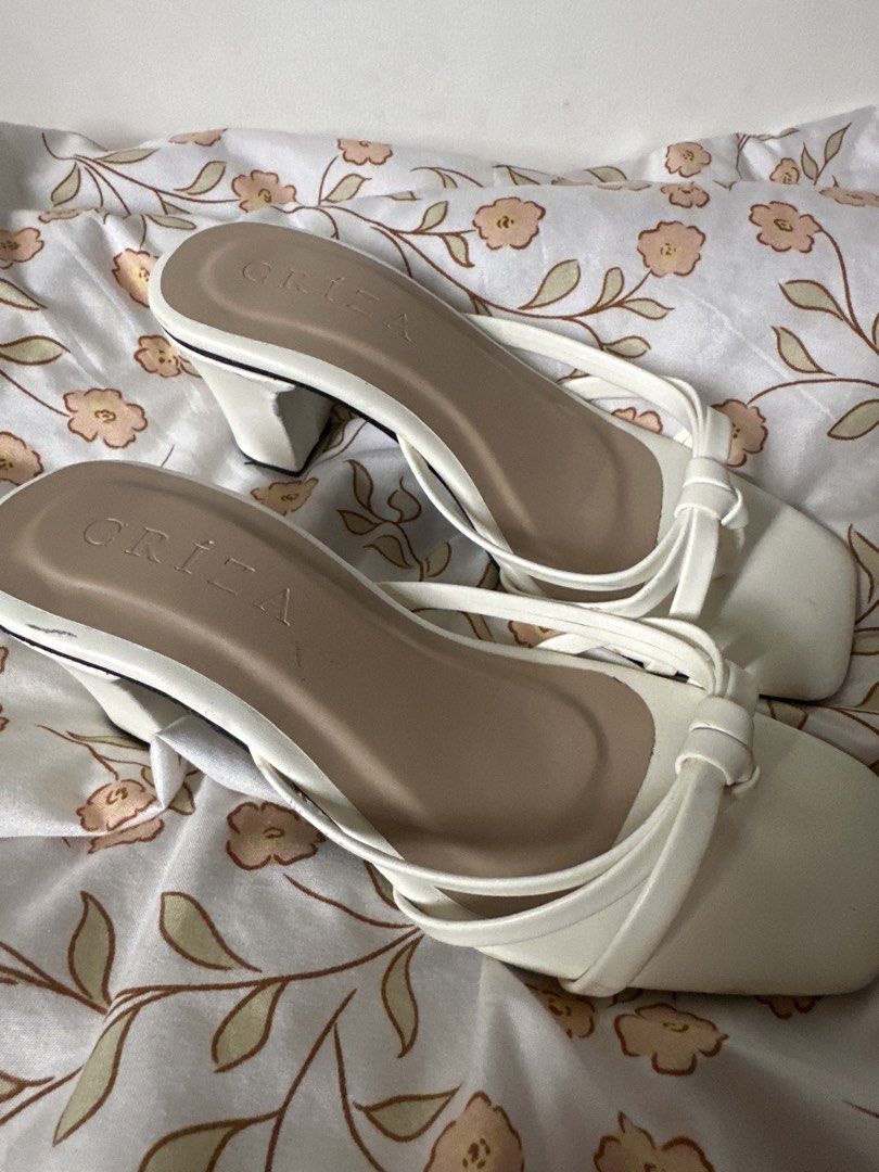 White Square Toe Heeled Sandals (Category: Flats & Sandals) located in Lipa City. Submitted by chiechums (Listing ID 1462949884, Image 1). Description: - Brand: GRIZA - Color: White - Style: Heeled Sandals - Toe Shape: Square Toe - Strap Detail: Knotted - Heel Type: Block Heel (Comfortable) - Closure: Slip-on - Occasion: Dress up or down.