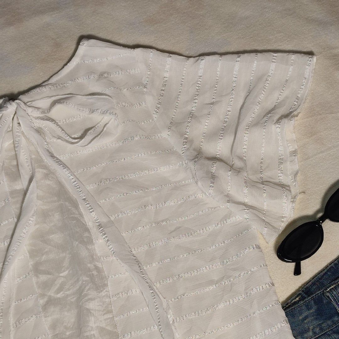 White Textured Bow Back Short Sleeve Top (Category: Blouses) located in Antipolo. Submitted by _lovedbychie (Listing ID 1462898278, Image 3). Description: 🌸 Size: S-M 🌸 Bust: 34" - 36" • Length: 23" 🌸 MOP: Gcash / Maribank 🌸 MOD: J&T / LBC / Lalamove Message me for more info!.