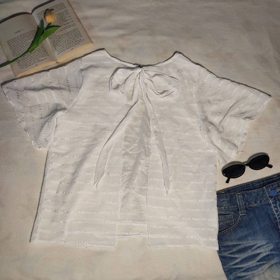 White Textured Bow Back Short Sleeve Top (Category: Blouses) located in Antipolo. Submitted by _lovedbychie (Listing ID 1462898278, Image 1). Description: 🌸 Size: S-M 🌸 Bust: 34" - 36" • Length: 23" 🌸 MOP: Gcash / Maribank 🌸 MOD: J&T / LBC / Lalamove Message me for more info!.
