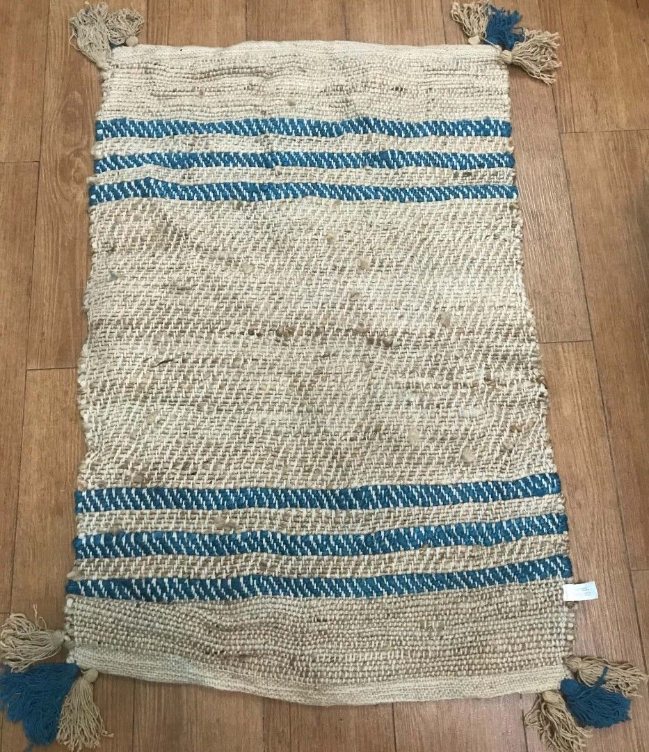 Woven Rug with Tassels (Category: Carpets, Mats & Flooring) located in Imus. Submitted by stop_shop7 (Listing ID 1462955786, Image 1). Description: - Woven rug with stylish blue stripes - Features charming tassels - Handcrafted in India - Perfect for adding texture and warmth - Ideal for entryways, kitchens, or any small space.