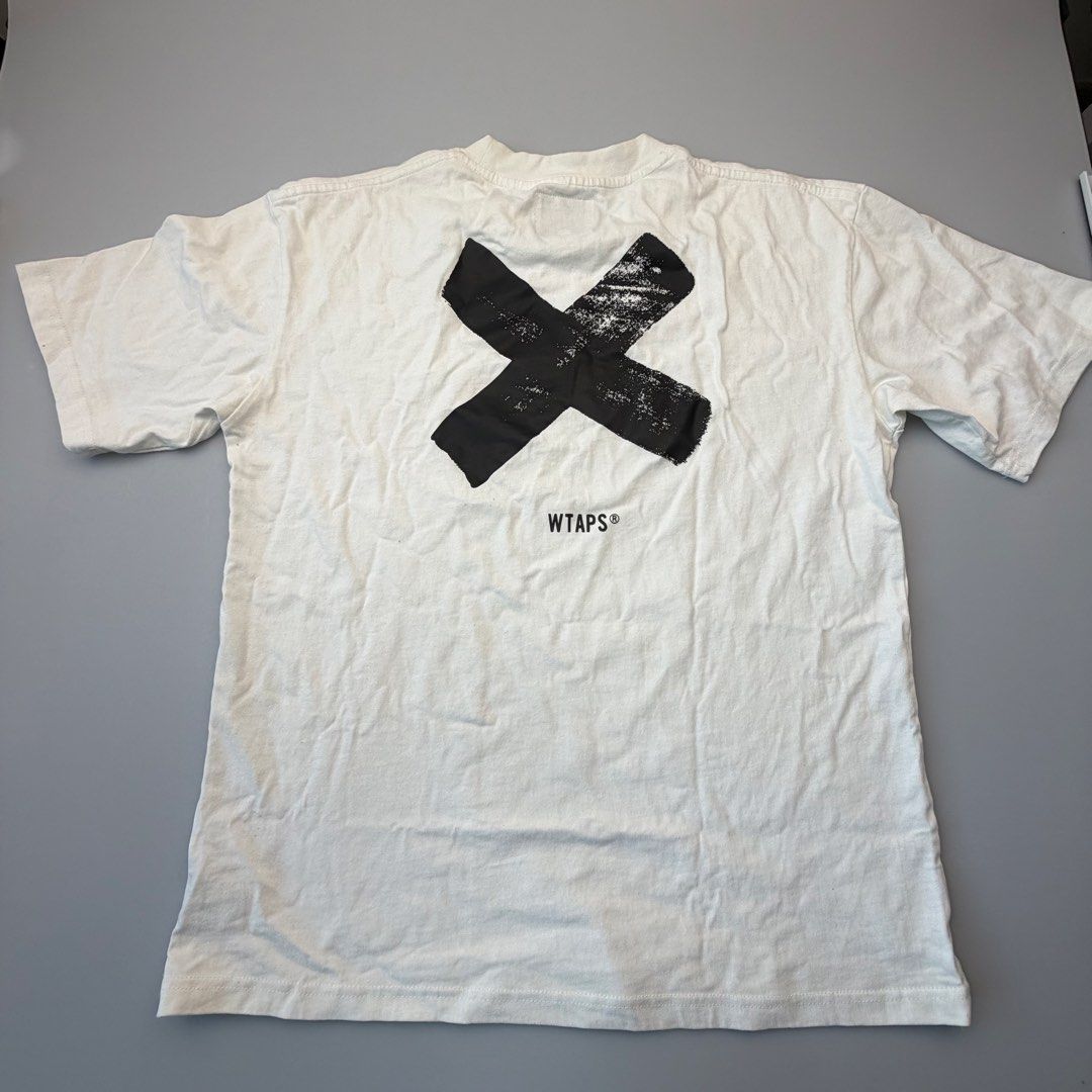 WTAPS X Logo White T-Shirt Tee Size L (Category: Tshirts & Polo Shirts ) located in San Juan City. Submitted by vc828 (Listing ID 1463031769, Image 1). Description: WTAPS white short sleeve T-shirt with small WTAPS® chest logo and large distressed X graphic on the back. Size: L Approx. measurements: 24” pit to pit, 27” length 100% cotton Pre-owned condition with normal signs of wear. Please review all photos for condition and measurements..