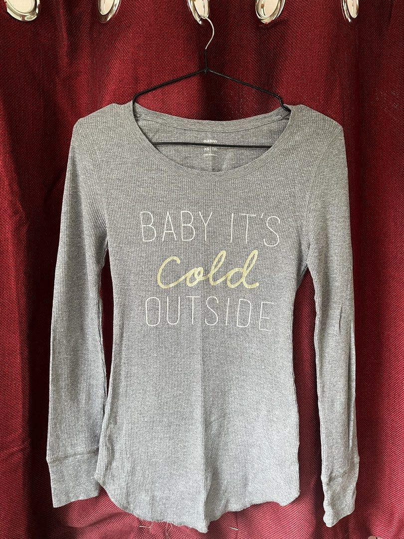 y2k Old Navy Grey long sleeved top (Category: Longsleeves) located in Manila. Submitted by youngwind-72b3 (Listing ID 1462992400, Image 1). Description: - Grey long-sleeve top - Brand: Old Navy - Ribbed texture - "Baby It's Cold Outside" graphic with yellow script "Cold" - Size: XS - Perfect for cozy weather.