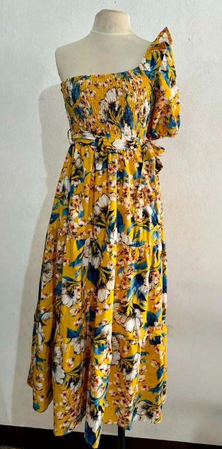 Yellow Floral Maxi Dress (Category: Dresses) located in Manila. Submitted by hyper.hertz. (Listing ID 1463020793, Image 1). Description: - Bright yellow maxi dress with vibrant floral print - One-shoulder design - Smocked bodice for a comfortable, adjustable fit - Tie waist to cinch your silhouette - Flowy tiered skirt for beautiful movement Negotiations are available.