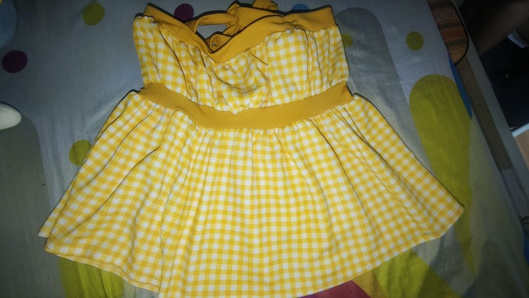 Yellow Gingham Dress with Tie Straps (Category: Dresses) located in Manila. Submitted by rare.elieli (Listing ID 1463078492, Image 1). Description: - Adorable yellow gingham pattern - Straps that are tied for custom fit - Comfortable elasticated waistband - Ideal for casual days or beach getaways - Effortless to wear and style.