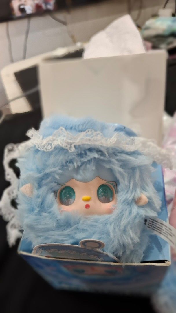 Yooki Blues Bubble (Category: Plushies & Soft Toys) located in Manila. Submitted by jonelllliiii (Listing ID 1462982974, Image 2). Description: - Adorable blue fluffy plush toy - Features big green eyes and a little yellow nose - Delicate white lace trim around the head - Comes with a cute illustrated box - Ideal for collectors or as a thoughtful gift.