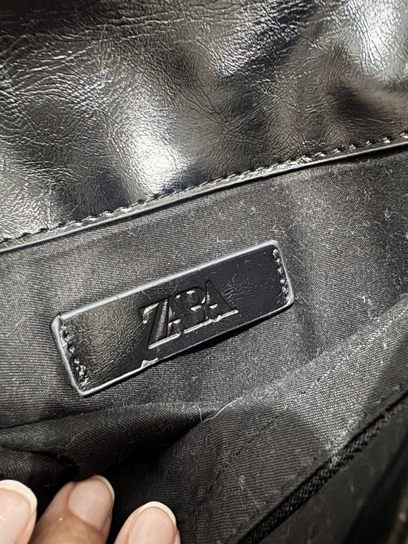 Zara Black Quilted Chain Shoulder Bag (Category: Shoulder Bags) located in Bacolod City. Submitted by matahum.bcd (Listing ID 1463058559, Image 3). Description: - Zara black shoulder bag - All-over quilted pattern - Silver chain strap - Magnetic snap closure - Interior zippered pocket - Versatile for everyday or evening wear.