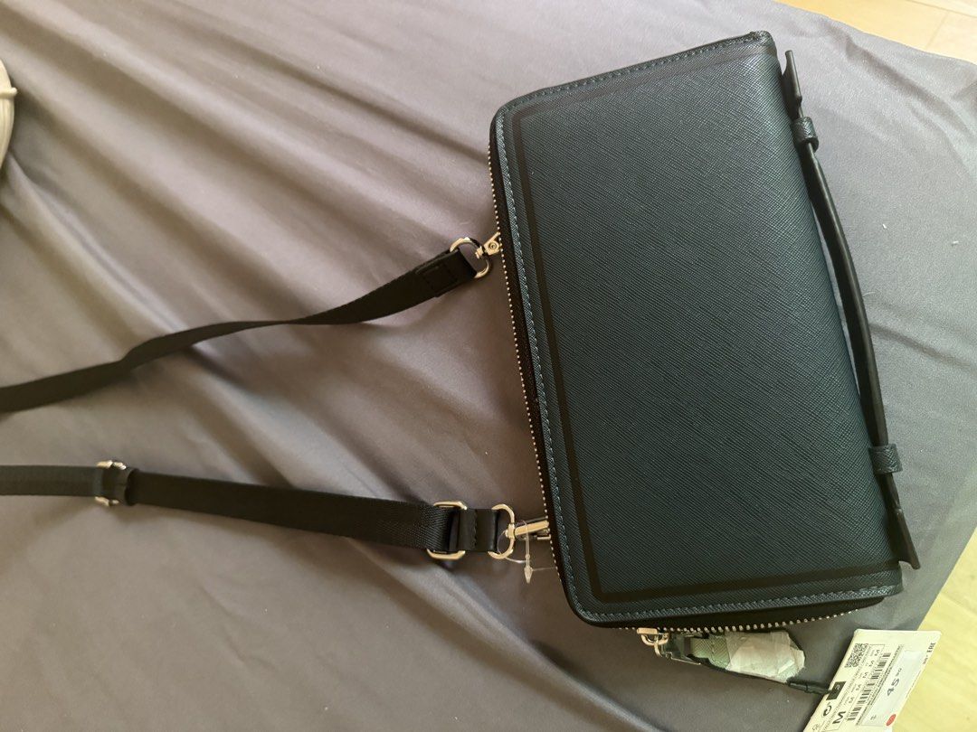 Zara Black Wallet Clutch (Category: Wallets & Card holders) located in Cavite. Submitted by ccaammss (Listing ID 1462935609, Image 3). Description: - Zara black textured wallet - Detachable strap included - Ample card slots for organization - Secure zip compartments - Brand new with original tag attached - Ideal for keeping your essentials tidy -100% original and was bought in Canada.