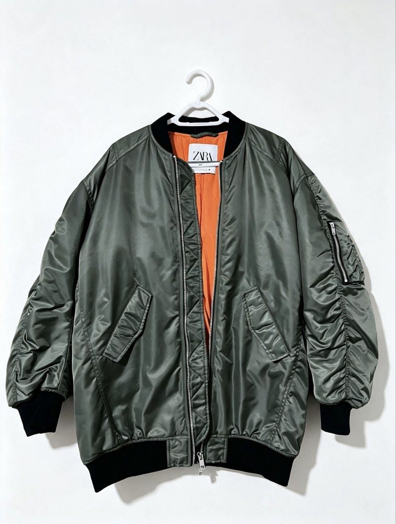 Zara Oversized Bomber Jacket Olive Green Orange Lining (Category: Coats, Jackets and Outerwear) located in Manila. Submitted by joshuahonggg (Listing ID 1462998726, Image 1). Description: Zara Padded Bomber Jacket Olive green Classic MA-1 style Orange inside No issue Only ₱3,500 Original retail price: ₱5,000.