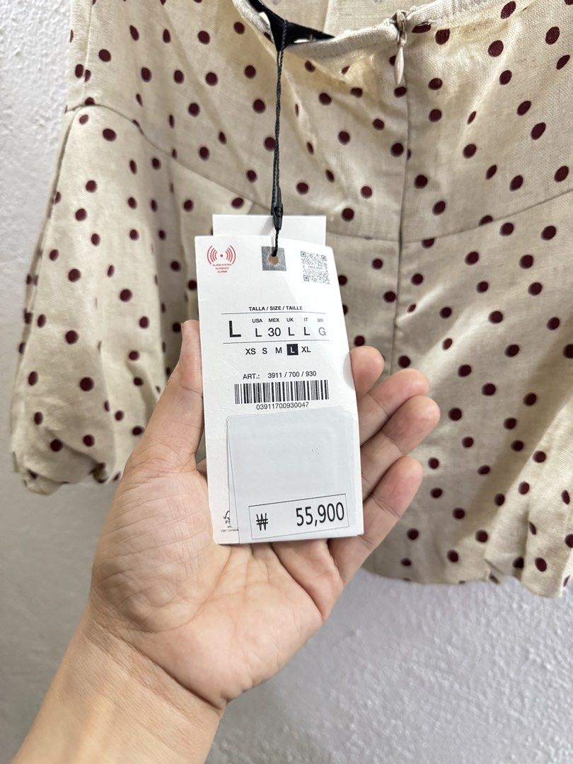 Zara Polka Dot Halter Neck Top with Tie Back (Category: Sleeveless) located in Manila. Submitted by janelica220598 (Listing ID 1462896801, Image 3). Description: - Cute beige top with dark red polka dots - Halter neck with tie-back closure - Peplum hem with gathered detail - Zipper closure at the back - Versatile for casual or night out looks.