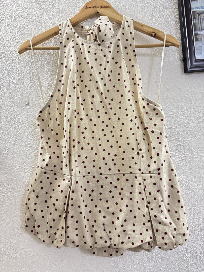 Zara Polka Dot Halter Neck Top with Tie Back (Category: Sleeveless) located in Manila. Submitted by janelica220598 (Listing ID 1462896801, Image 1). Description: - Cute beige top with dark red polka dots - Halter neck with tie-back closure - Peplum hem with gathered detail - Zipper closure at the back - Versatile for casual or night out looks.