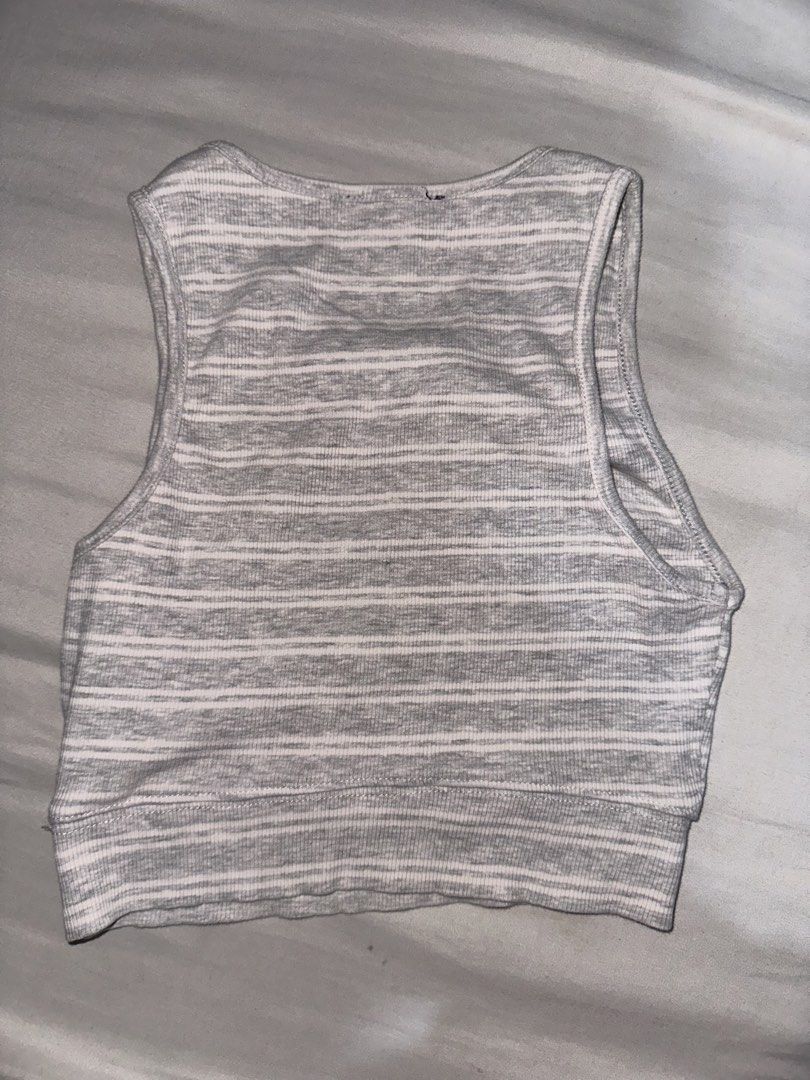 Zara Striped Ribbed Crop Tank Top (Category: Sleeveless) located in Manila. Submitted by etain.xo (Listing ID 1463027821, Image 2). Description: - Zara grey and white striped ribbed crop tank top - Sleeveless design with a rounded neckline - Stretchy material for a comfortable fit - Versatile for layering or wearing on its own - Fits xxs to s.