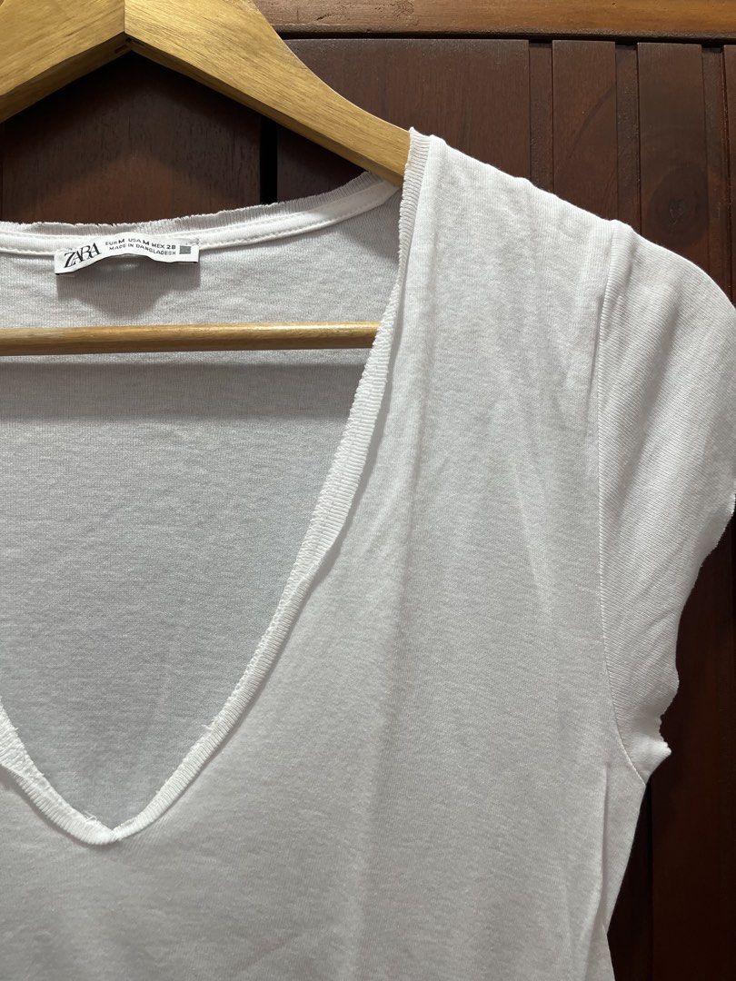 Zara White V-Neck T-Shirt (Category: Shirts) located in Cagayan de Oro. Submitted by prelovederela (Listing ID 1463020545, Image 3). Description: staple tee! yan talaga design nya like new! used once lng huhu!.