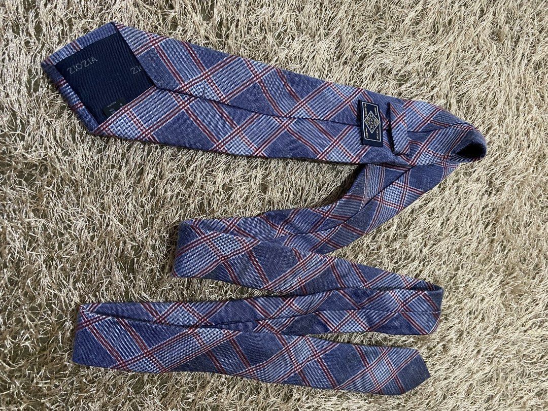 Ziozia Blue Plaid Necktie (Category: Ties) located in Bulacan. Submitted by rich2545 (Listing ID 1462901765, Image 3). Description: - Classic blue necktie by Ziozia - Features a red and white plaid pattern - Versatile for both formal and casual occasions - Adds a stylish touch to any outfit.