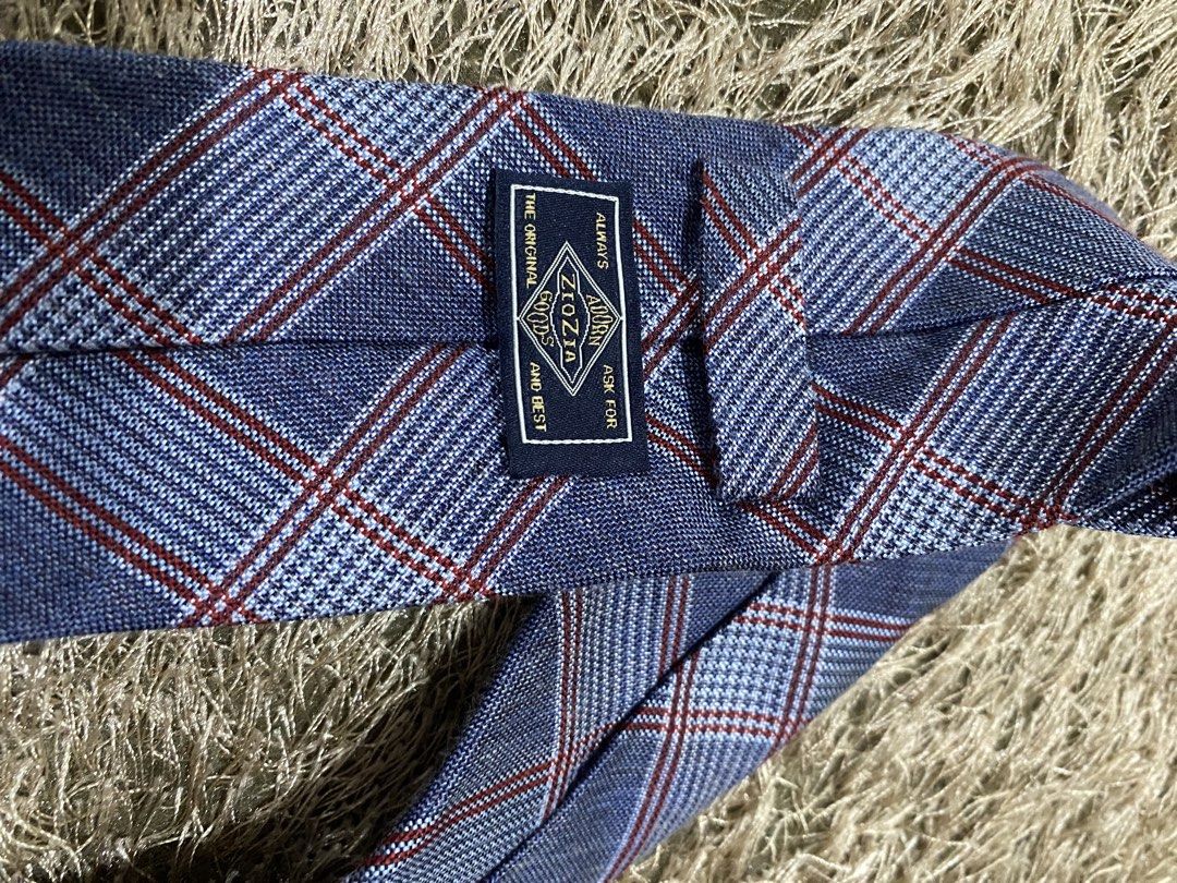 Ziozia Blue Plaid Necktie (Category: Ties) located in Bulacan. Submitted by rich2545 (Listing ID 1462901765, Image 2). Description: - Classic blue necktie by Ziozia - Features a red and white plaid pattern - Versatile for both formal and casual occasions - Adds a stylish touch to any outfit.