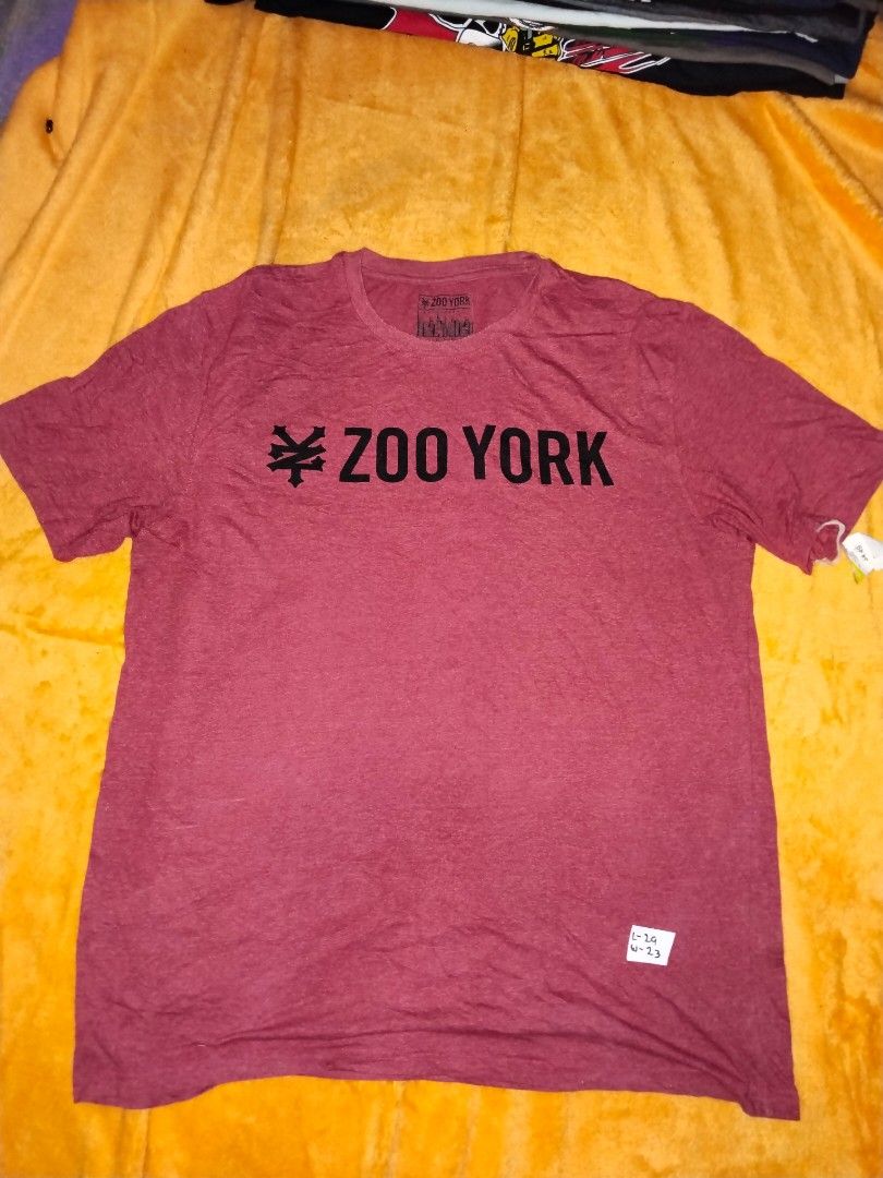 Zoo York Shirt XL (Category: Tshirts & Polo Shirts ) located in Mabalacat. Submitted by al_amin_thrift (Listing ID 1463019515, Image 1). Description: 🛹 Zoo York T-Shirt — Size XL - Brand: Zoo York — Iconic NYC skateboarding / streetwear brand ​ - Color: Heather Maroon / Burgundy ​ - Design: Classic bold black logo print on front ​ - Size: XL — regular comfortable fit ​ - Fabric: 60% Cotton / 40% Polyester — soft, lightweight, breathable ​ - Cond