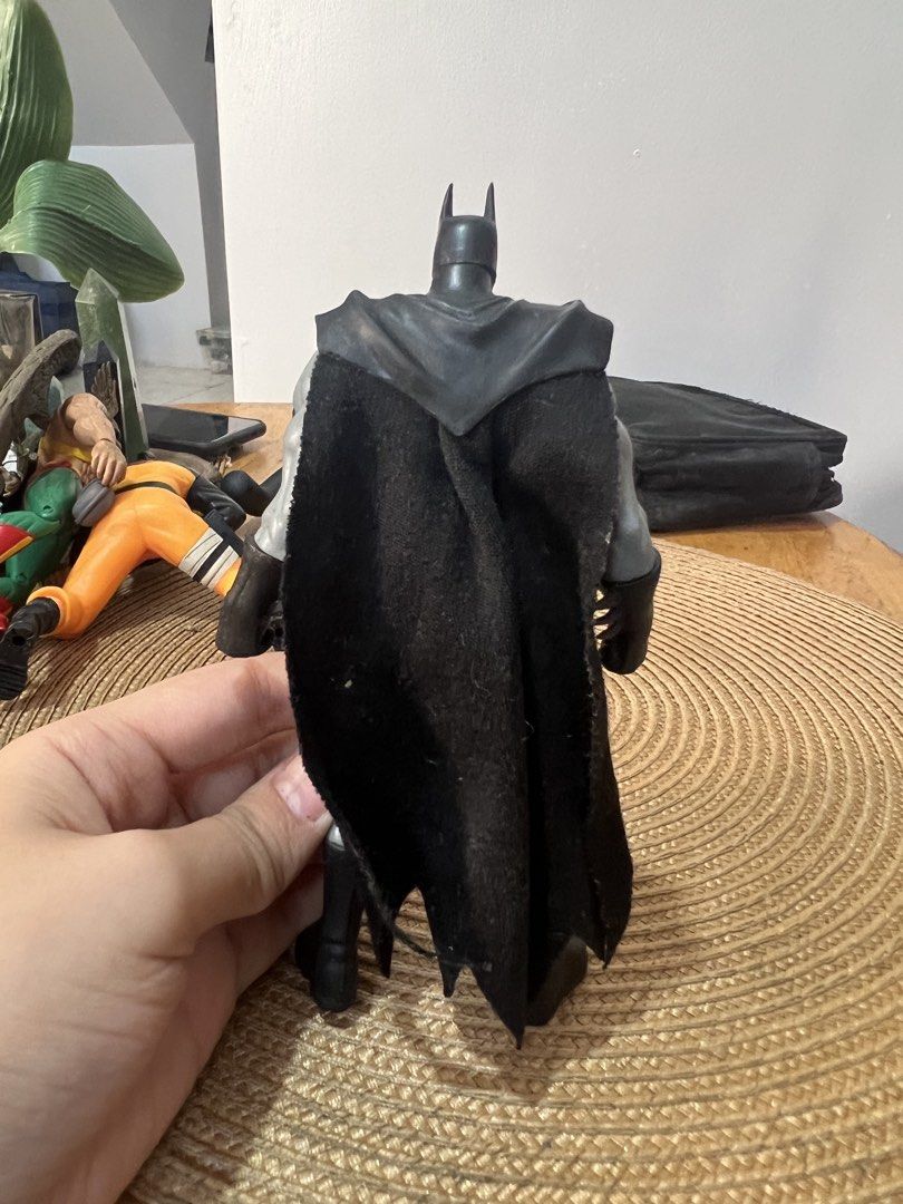 2003 Mattel Zipline DC Comics Batman Action Figure (Category: Action & Battle Toys) located in Bocaue. Submitted by kwon_017 (Listing ID 1463127144, Image 2). Description: - DC Comics Batman Action Figure - Approximately 6 inches tall - Fabric cape for realistic look - Iconic yellow utility belt - Articulated joints for posing - Minor speckling on body and face (adds character!) - Essential addition to any Batman fan's collection.