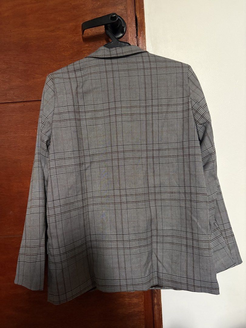 22 Made by Korea Plaid Blazer (Category: Coats, Jackets and Outerwear) located in Taguig. Submitted by cftbncs (Listing ID 1463176804, Image 3). Description: - Grey plaid blazer - Brand: 22 Made by Korea - Two-button closure - Front pockets - Fully lined interior - Ideal for layering over tops or dresses - Creates a sharp, put-together look.
