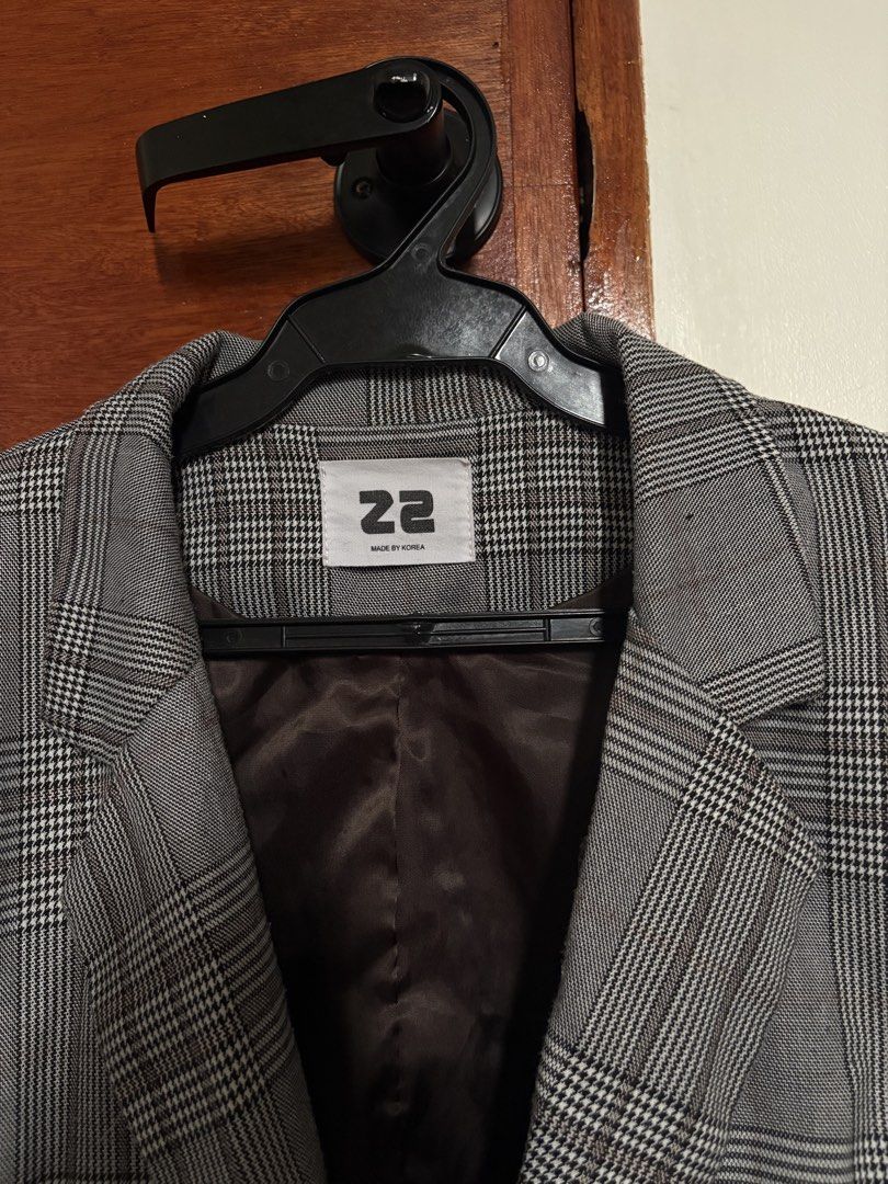 22 Made by Korea Plaid Blazer (Category: Coats, Jackets and Outerwear) located in Taguig. Submitted by cftbncs (Listing ID 1463176804, Image 2). Description: - Grey plaid blazer - Brand: 22 Made by Korea - Two-button closure - Front pockets - Fully lined interior - Ideal for layering over tops or dresses - Creates a sharp, put-together look.
