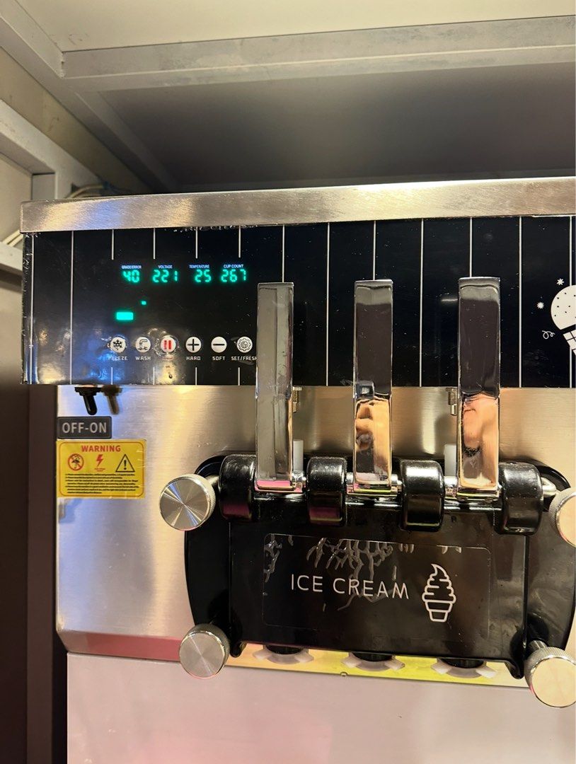 3-Nozzle Soft Serve Ice Cream Machine (Category: Ice-cream Makers) located in Pasay City. Submitted by fibi.beltran (Listing ID 1463182874, Image 1). Description: FOR SALE🍦 3-Nozzle Soft Serve Ice Cream Machine Type: Commercial tabletop soft-serve machine Nozzles: 3 Configuration: 2 flavors + 1 mixed/twist Construction: Stainless steel Control: Digital control panel Functions visible: Freeze, Wash, Hard/Soft adjustment, Set/Reset Cooling: Compre