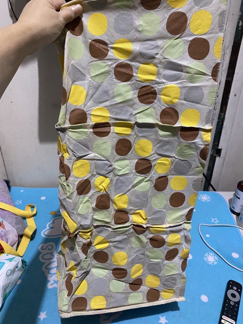 3-Tier Hanging Storage Organizer with Polka Dot Pattern (Category: Storage Boxes & Baskets) located in Manila. Submitted by resi.diaz (Listing ID 1463233406, Image 2). Description: - 3-tier hanging storage organizer - Fun polka dot pattern in yellow, brown, green, and grey - Ideal for closets or shelves - Folds flat for easy storage - Features straps for convenient hanging - Versatile for storing clothes, toys, or accessories.