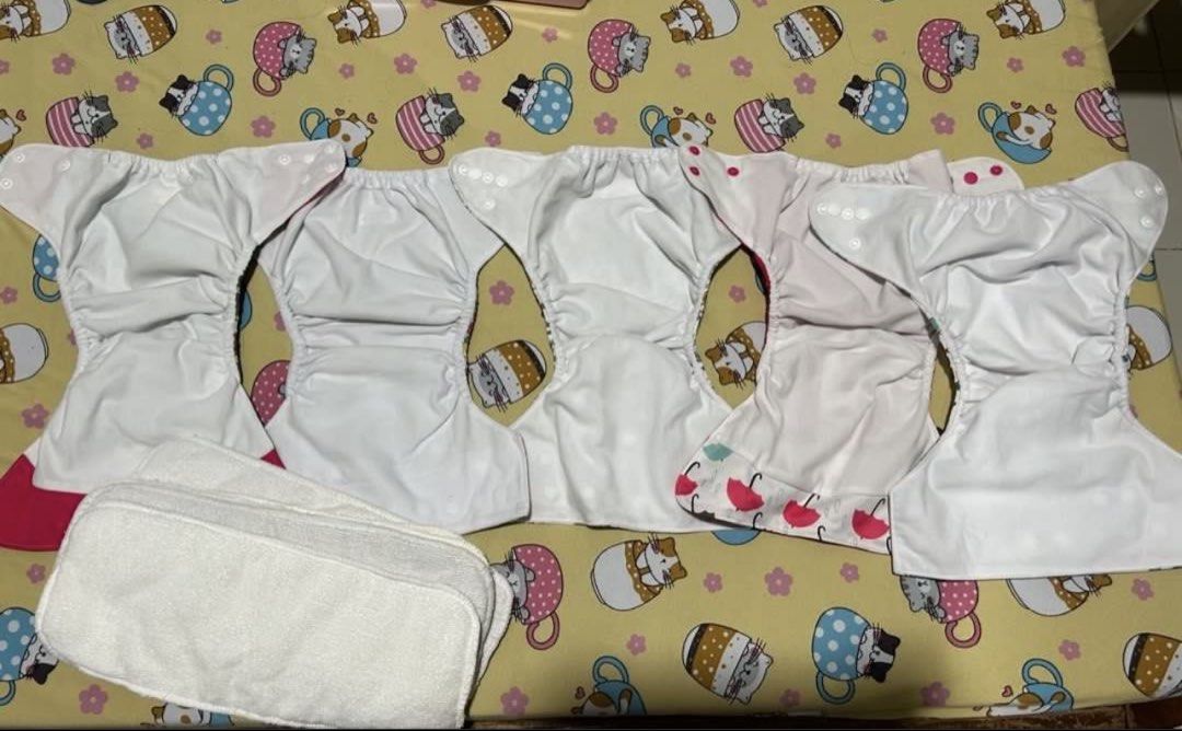 Cloth diaper (Category: Diapers & Baby Wipes) located in Imus. Submitted by mommaerika (Listing ID 1463242777, Image 3). Description: ❗90 each or 399 take all❗ - Mixed of Alva baby and Happy flute CDs - Includes 5 inserts - Comes with Aimerie Laundry Treatment (almost 20-25g remaining) for deep cleaning Rfs: Di talaga kaya ng schedule mag-CD. 🥲 Let go ko na lang yung remaining CDs ni lo. Buhay na Tubig Imus location.