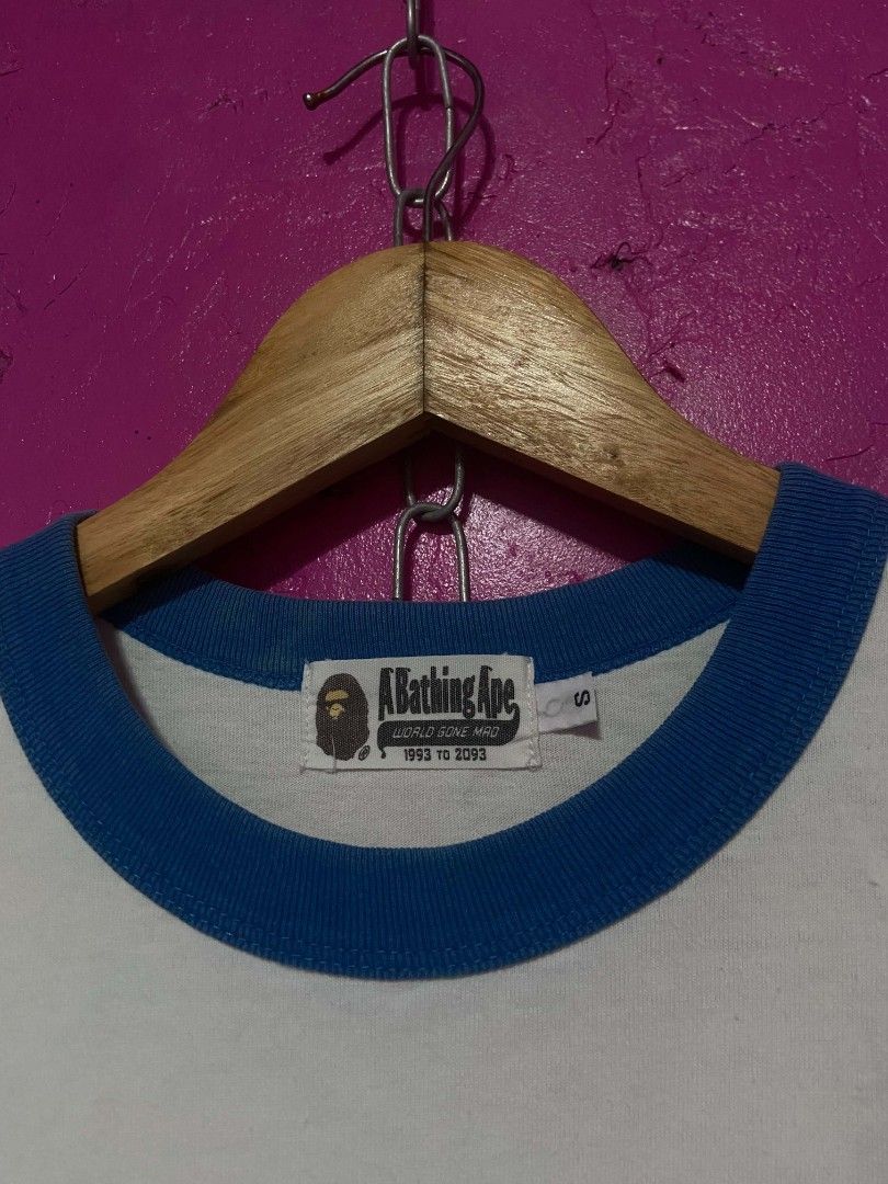 A Bathing Ape Baby Milo Graphic Tee (Category: Tshirts & Polo Shirts ) located in Manila. Submitted by matthew_parilla (Listing ID 1463179646, Image 2). Description: - Authentic A Bathing Ape (BAPE) Ringer Tee - Features iconic Baby Milo graphic with binoculars - Yellow polka dot strap detail - Blue trim on collar and sleeves - Size: S - Ideal for BAPE enthusiasts and collectors.