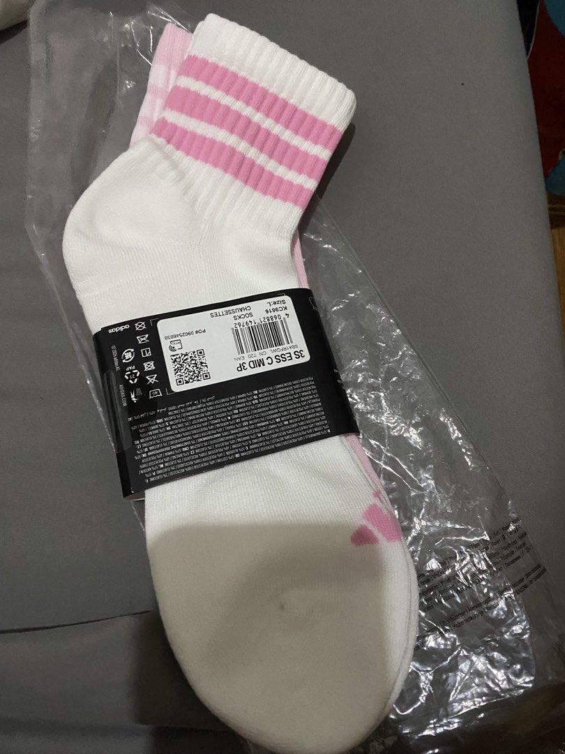 Adidas 3S ESS MID 3P Socks White Pink (Category: Socks & Tights) located in General Tinio. Submitted by andy_1129 (Listing ID 1463129546, Image 1). Description: - Two pairs of Adidas ankle socks - White with pink stripes and classic Adidas logo - Cushioned for enhanced comfort - Size large - Ideal for everyday wear or sports activities - Bundle deal: Get all three pairs together Large masyado malaki..