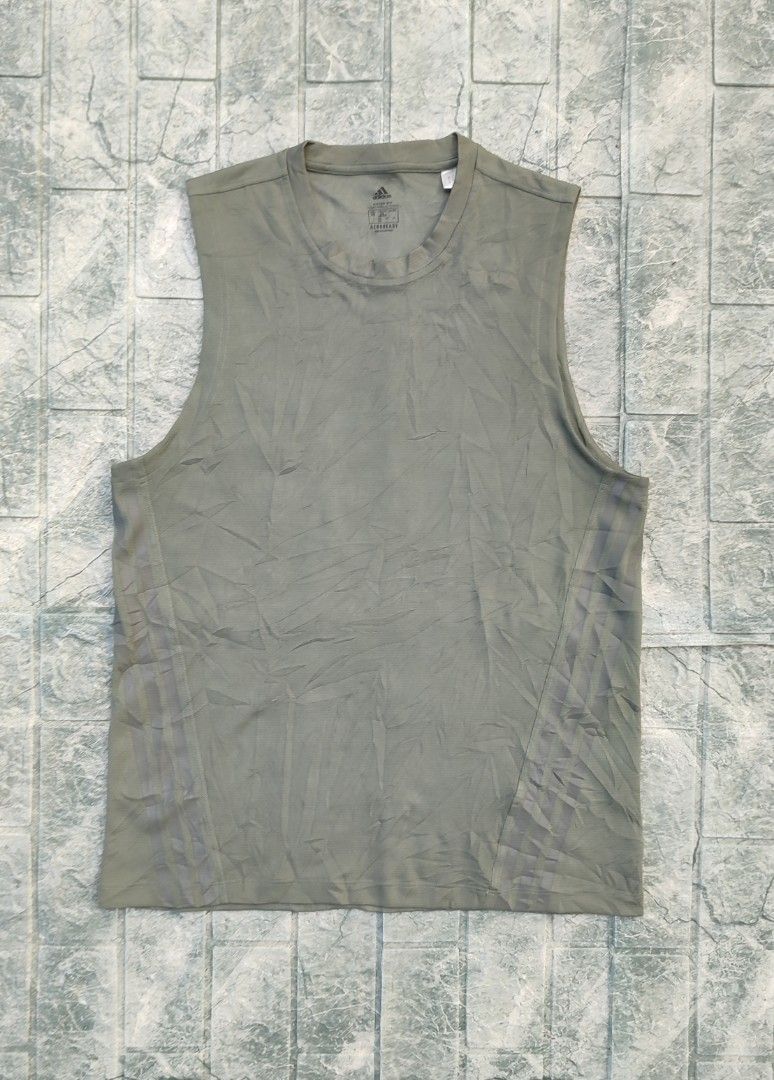 Adidas Aeroready Tank Top (Category: Activewear) located in Bayambang. Submitted by mon10192816 (Listing ID 1463326228, Image 1). Description: - Width 19¾ - Length 27.5 - Issue Cut wash tag - Adidas tank top in muted green - Made with breathable Aeroready material - Sleeveless design for comfort - Perfect for workouts or everyday casual wear.