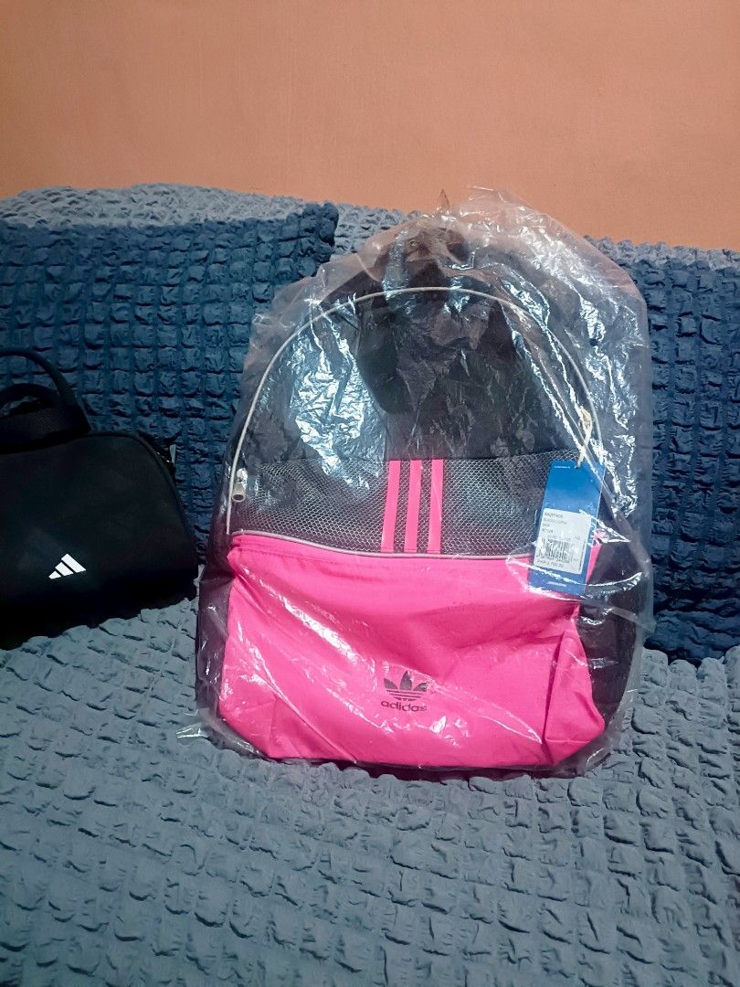 Adidas Backpack Black Pink Trefoil Logo (Category: Backpacks) located in Manila. Submitted by hannsjewels (Listing ID 1463222358, Image 1). Description: - Brand new Adidas backpack - Bright pink front pocket - Classic three stripes and trefoil logo - Mesh detail on the front orig price Php 2700 measurements: height 17 inch width 13 inch reflectorized other photo (not mine) for reference only. - Padded straps for comfort - Ideal for school or ever