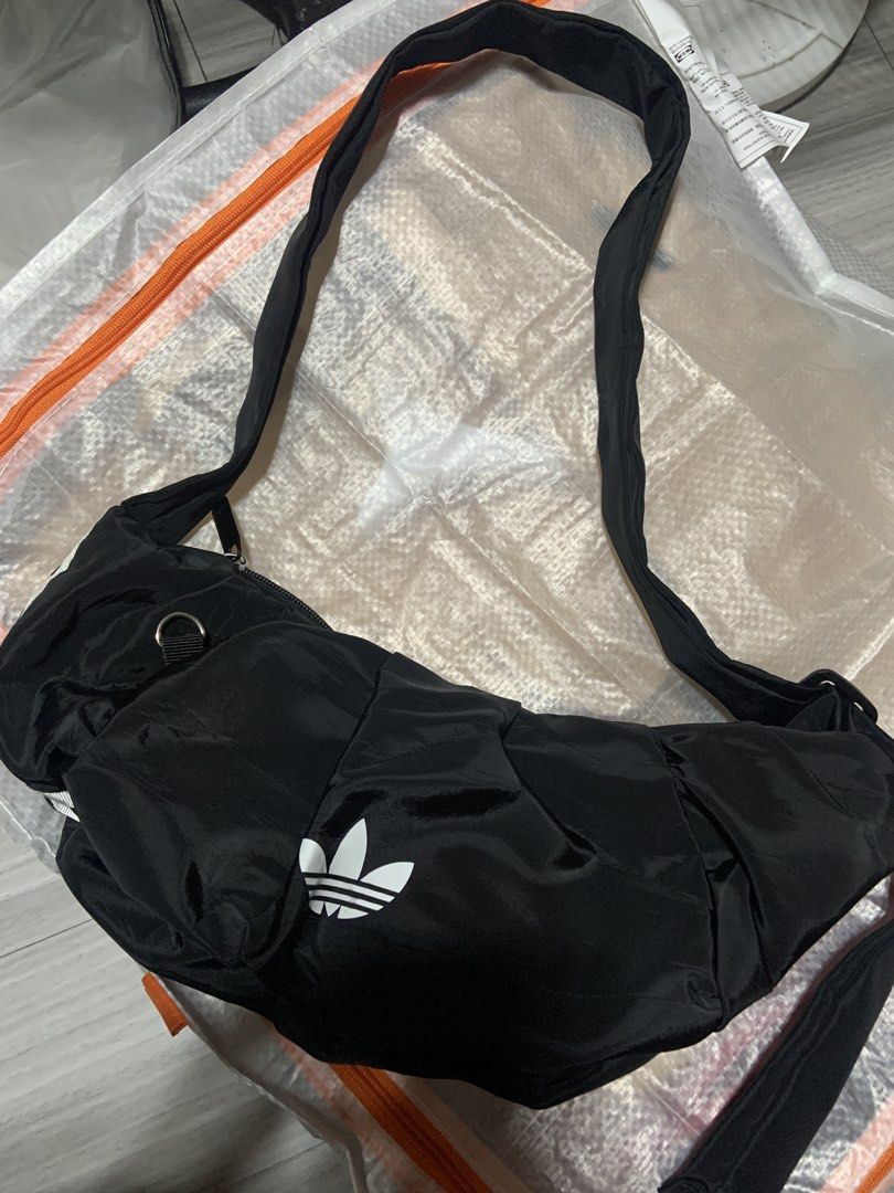 Adidas Black Crossbody Bag (Category: Cross-body Bags) located in Cainta. Submitted by yellowsol_ (Listing ID 1463194319, Image 1). Description: Cross body bag/Moon Bag .