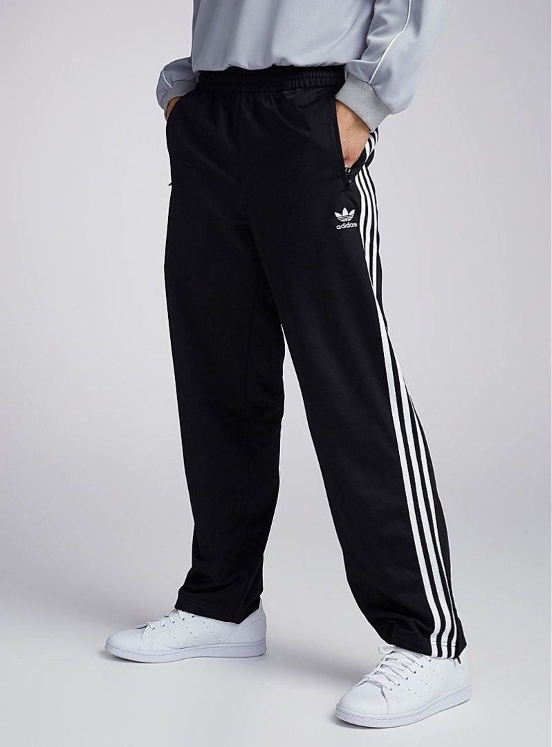 Adidas Black Track Pants (Category: Other Bottoms) located in General Santos City (Dadiangas). Submitted by yuungs (Listing ID 1462897829, Image 1). Description: - Classic black Adidas track pants - Iconic white stripes down the sides - Elastic waistband with drawstring for a comfortable fit - Two front zip pockets - Zippers at the ankle for easy on and off - Ideal for sports or casual wear Waist 26.5-34 Length 40.5 Leg opening 7 9/10 condition 4