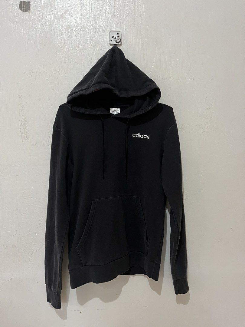 Adidas Essentials Small Logo Fleece Pullover Hoodie (Category: Hoodies) located in Manila. Submitted by chanie836 (Listing ID 1463262171, Image 1). Description: - Classic black Adidas hoodie - Features a clean white logo on the chest - Convenient front pocket - Adjustable drawstring hood - Tagged A/XS, S, 170/88A (Made in Indonesia) - Ideal for everyday casual wear.