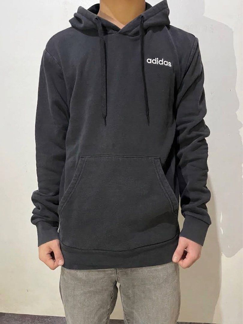 Adidas Essentials Small Logo Fleece Pullover Hoodie (Category: Hoodies) located in Manila. Submitted by chanie836 (Listing ID 1463262171, Image 2). Description: - Classic black Adidas hoodie - Features a clean white logo on the chest - Convenient front pocket - Adjustable drawstring hood - Tagged A/XS, S, 170/88A (Made in Indonesia) - Ideal for everyday casual wear.