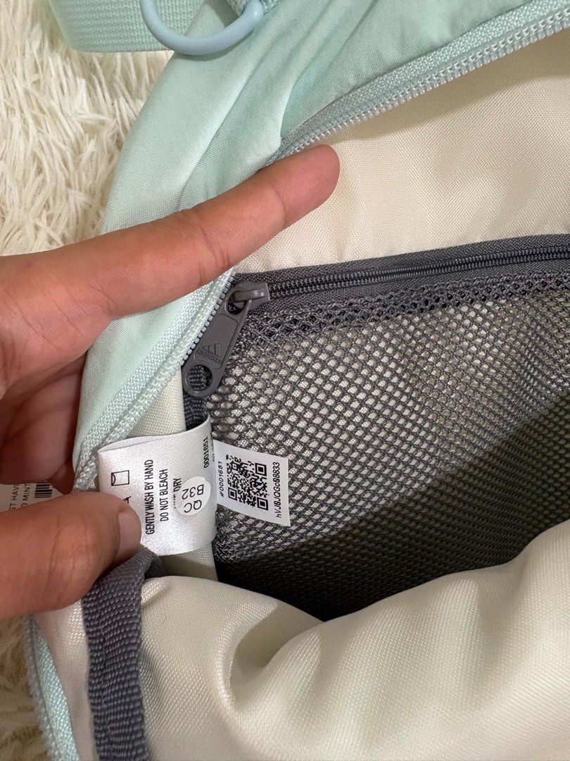 Adidas Mini Backpack Mint Green (Category: Backpacks) located in Manila. Submitted by aikhielfri01619 (Listing ID 1463247539, Image 3). Description: - Adorable mint green Adidas mini backpack. - Crafted from durable 100% nylon. - Features a spacious main compartment. - Includes a convenient front zip pocket. - Adjustable straps for a comfortable fit. - Ideal for everyday errands or your next getaway. - Compact size: approximately 10 inches tall..