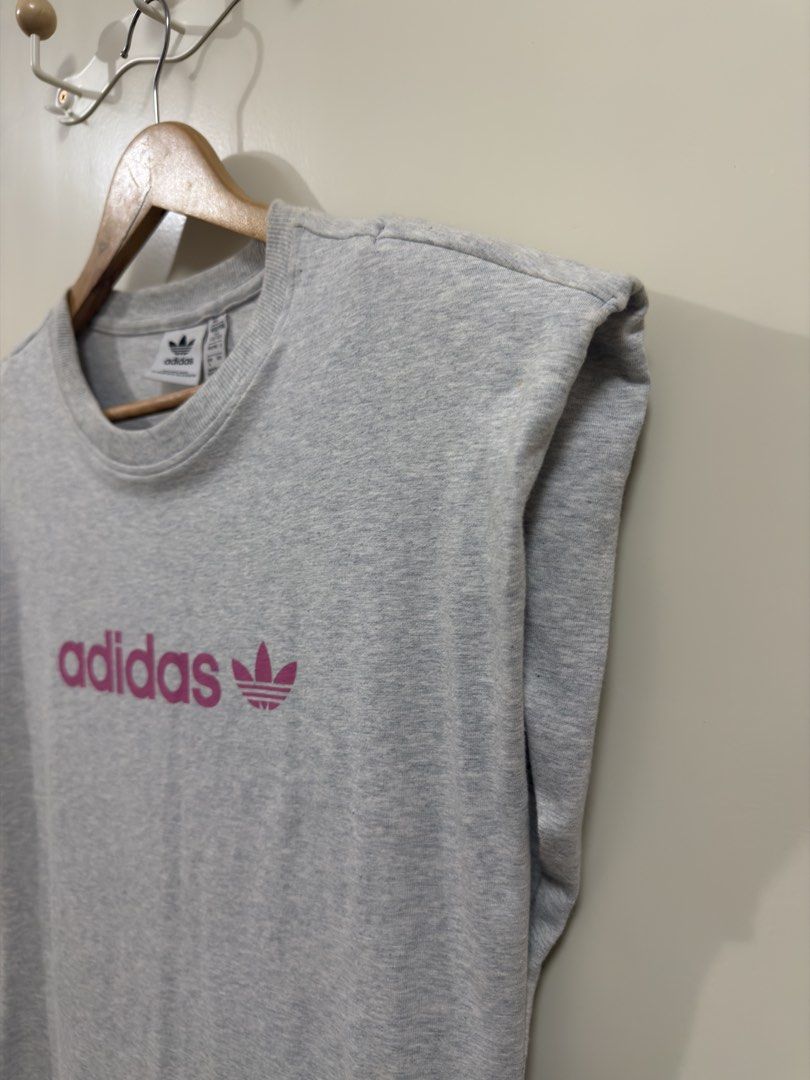 Adidas Muscle tee Dress (Category: Dresses) located in Manila. Submitted by lily.e0630 (Listing ID 1463287558, Image 3). Description: - Grey Adidas dress - Bought for 2,800 - Used once - Size: Large but can fit to medium - Sleeveless design - Padded shoulders - Classic pink Adidas logo on front .