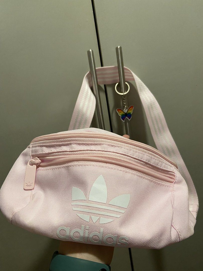 Adidas Pink Fanny Pack (Category: Purses & Pouches) located in Quezon City. Submitted by densyaaa12 (Listing ID 1463189525, Image 1). Description: Never been used. - Cute pink Adidas fanny pack - Two zippered compartments - Adjustable strap with classic Adidas stripes - Ideal for carrying your essentials.
