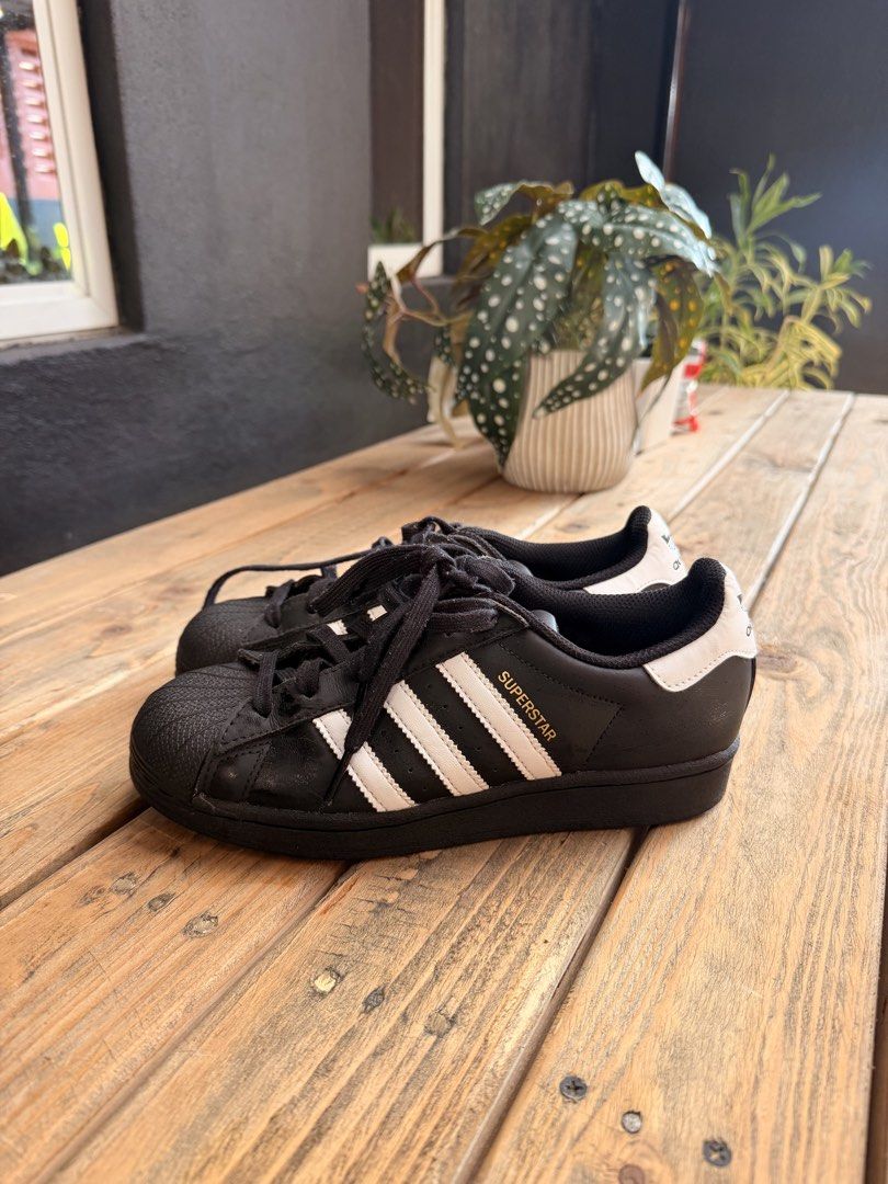 Adidas Superstar Black White Sneakers (Category: Sneakers) located in Tuguegarao City. Submitted by joysmithznjo (Listing ID 1463200813, Image 3). Description: - Classic Adidas Superstar sneakers - Color: Black with white stripes and heel tab - Iconic shell toe design - Black laces - Ideal for everyday wear - A staple for any sneaker collection.